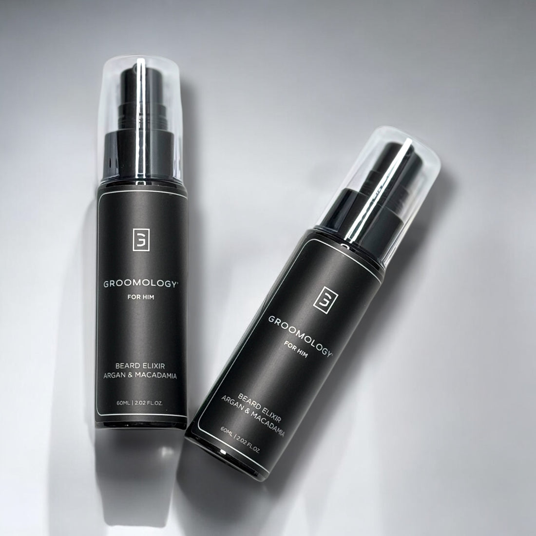 GROOMOLOGY® Argan & Macadamia Elixir in a sleek black bottle for premium beard care and nourishment.